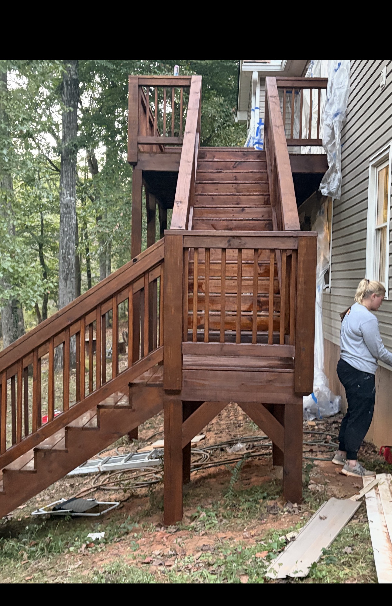 Newly stained wood staircase and railing on a Southern home