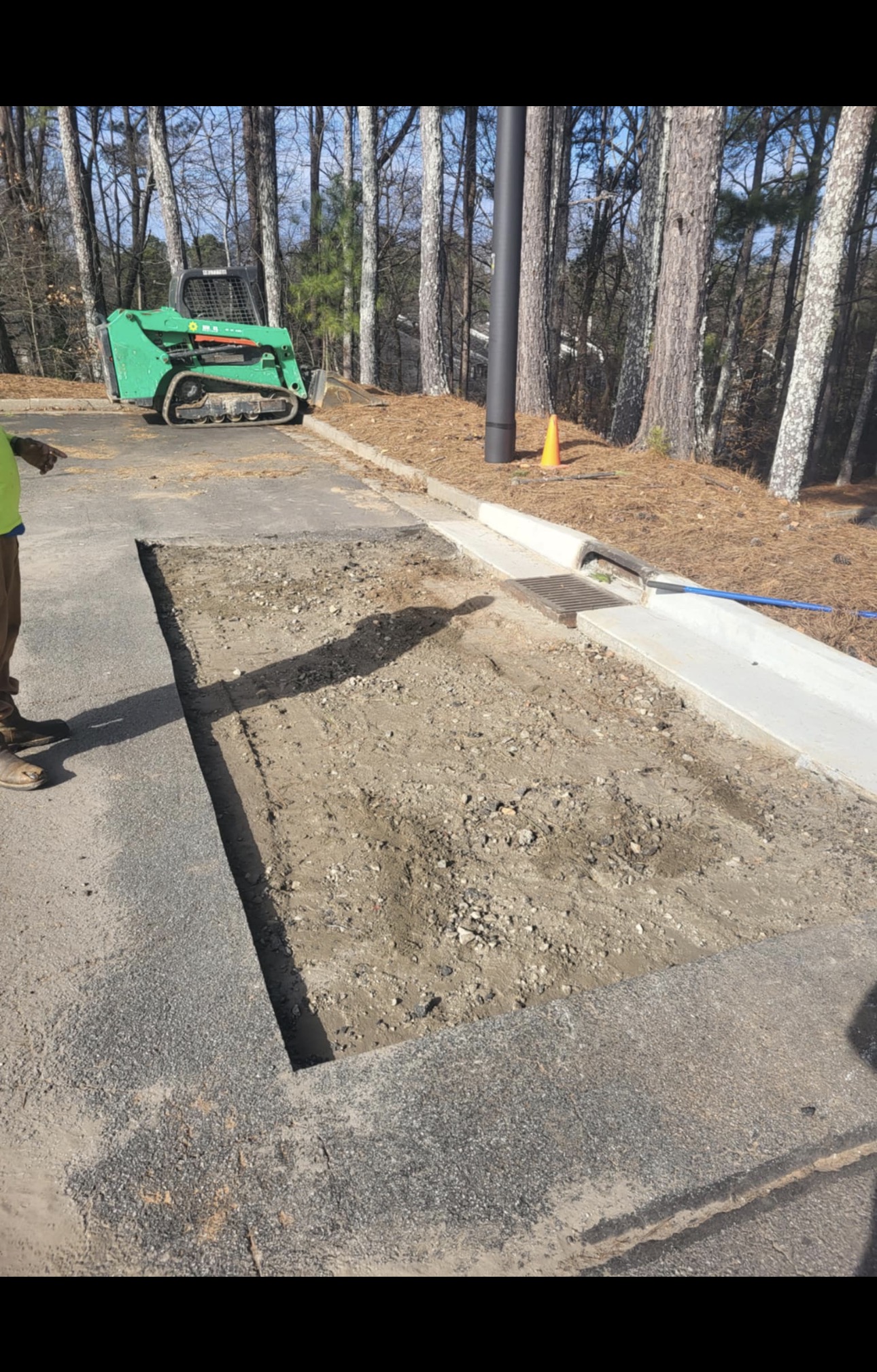 Weathered wood deck overlooking bare trees, before restaining